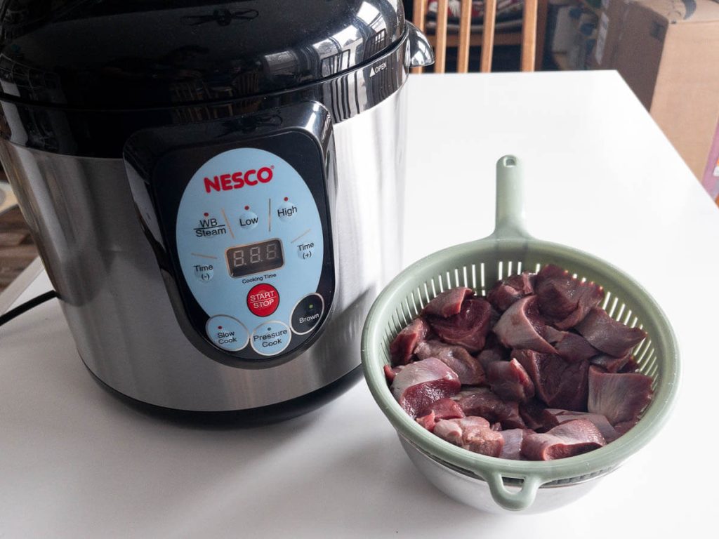 Nesco pressure cooker with bear meat