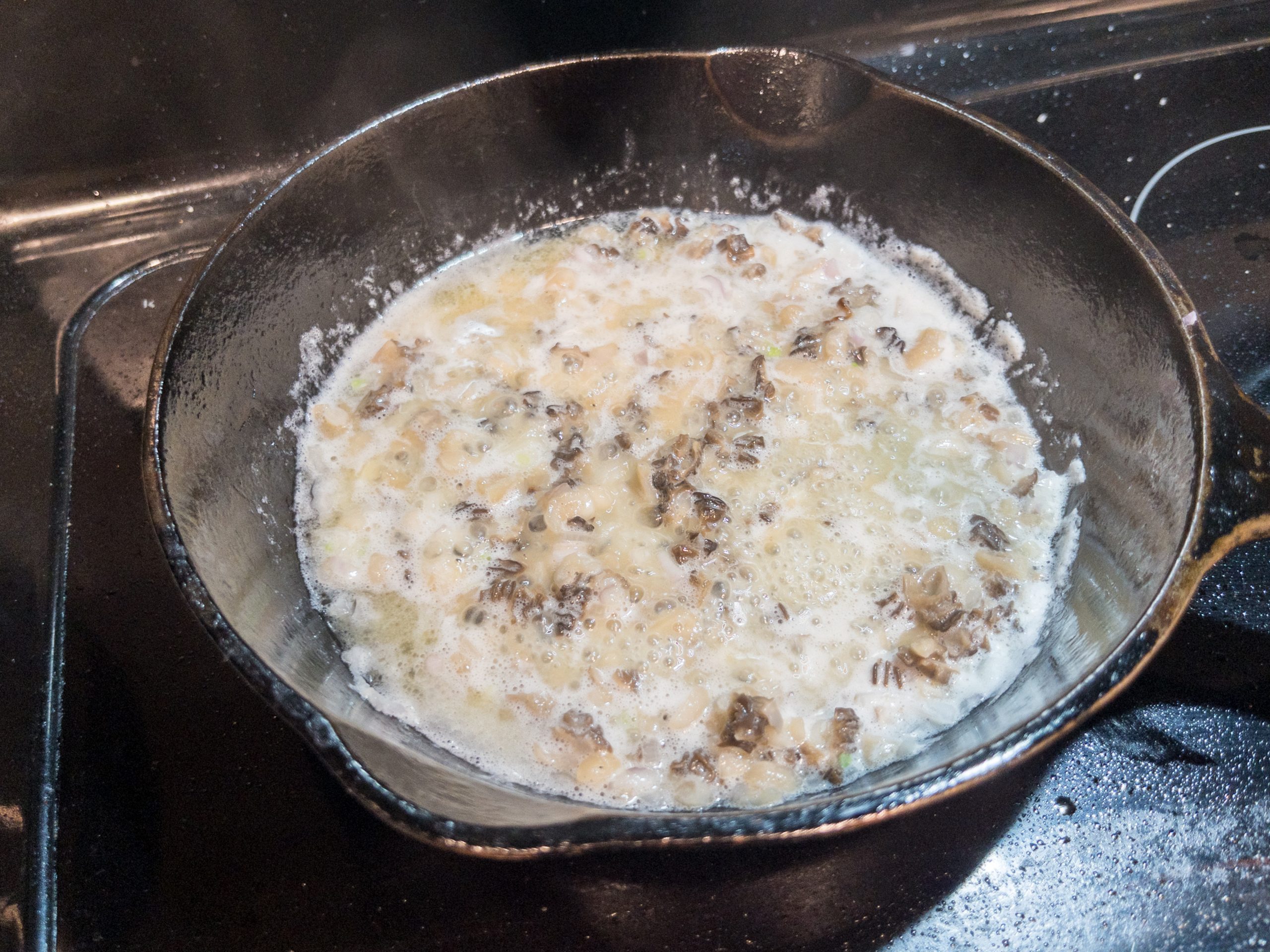 Cooking mushrooms in butter in a cast-iron pan