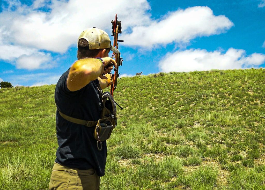 Bowhunter practicing archery in the great outdoors