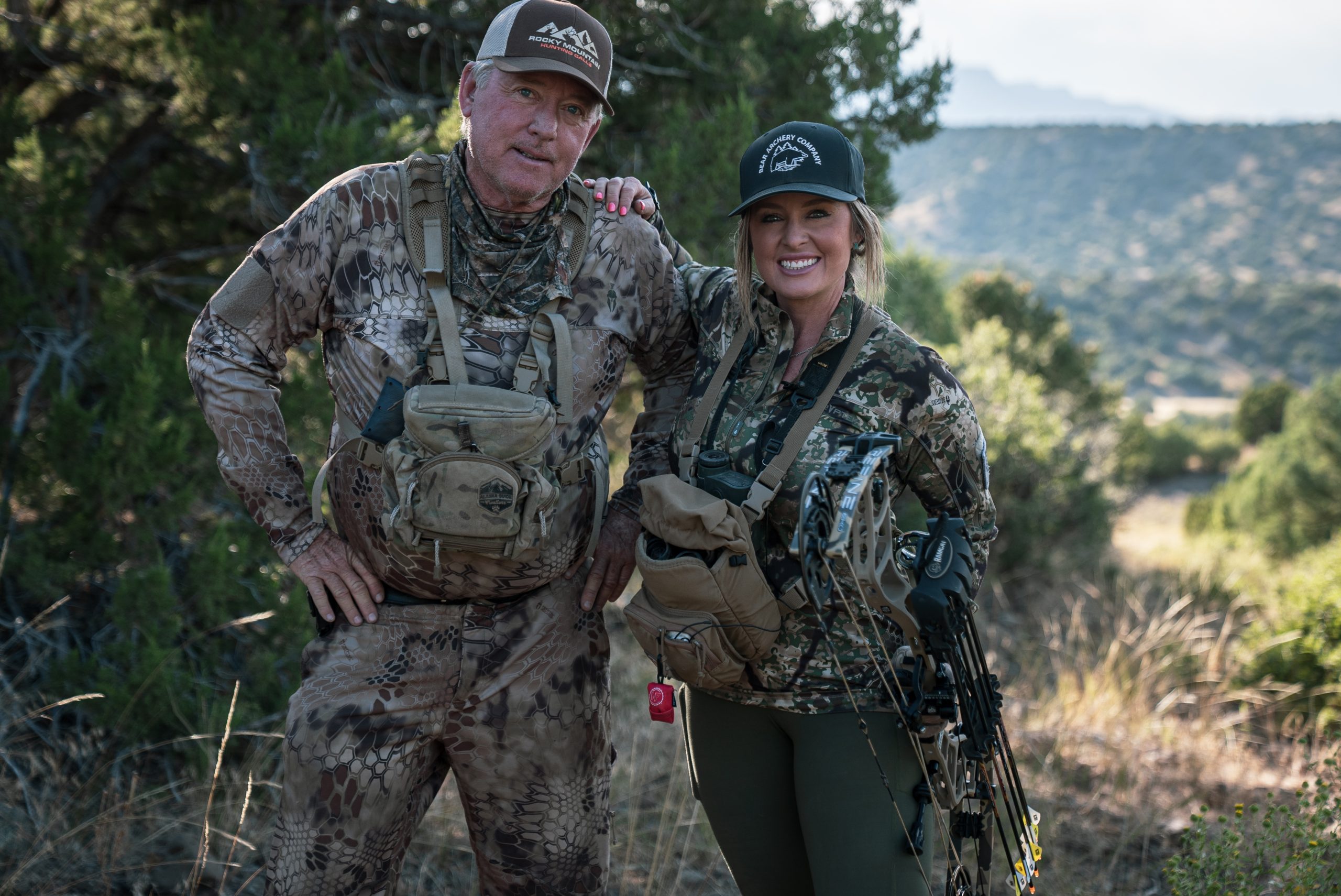 Two hunters decked out in camo on the mountain