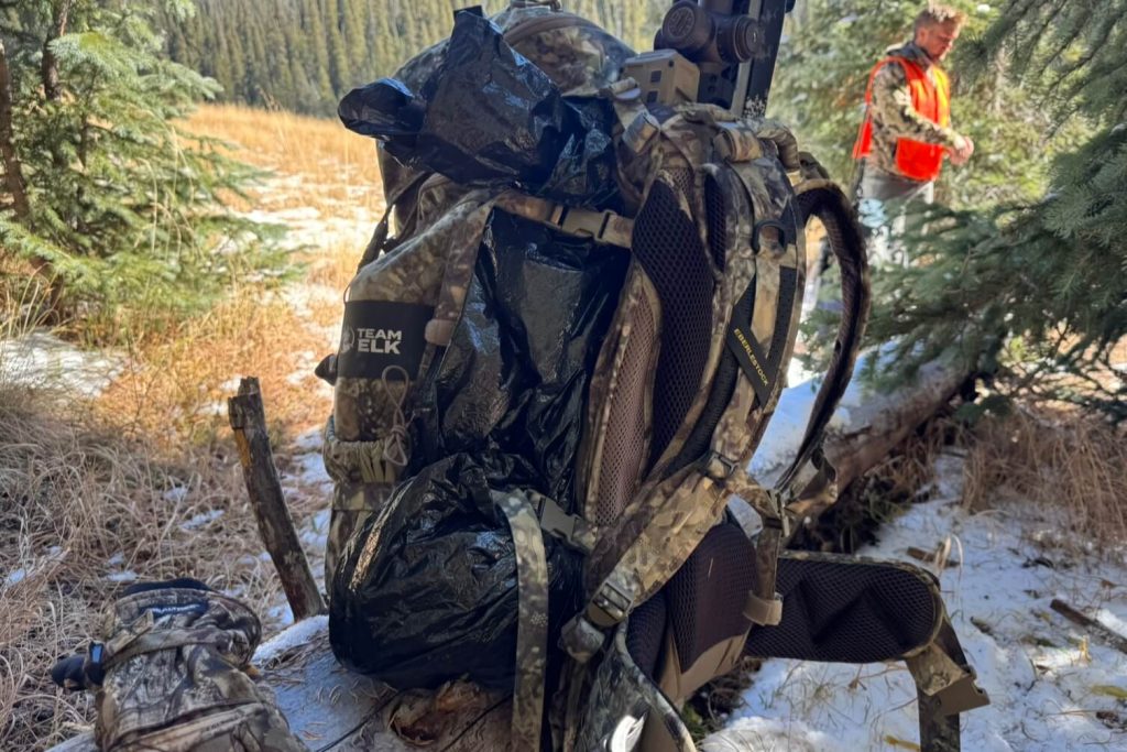 Meat carrying system cinched up holding my tent and sleeping bag nice and tight inside a trash bag