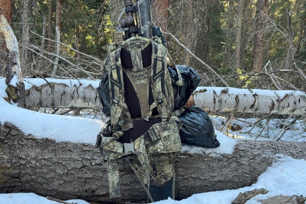 Rifle scabbard sticks out down below the hip belt, but does not bother me when hiking