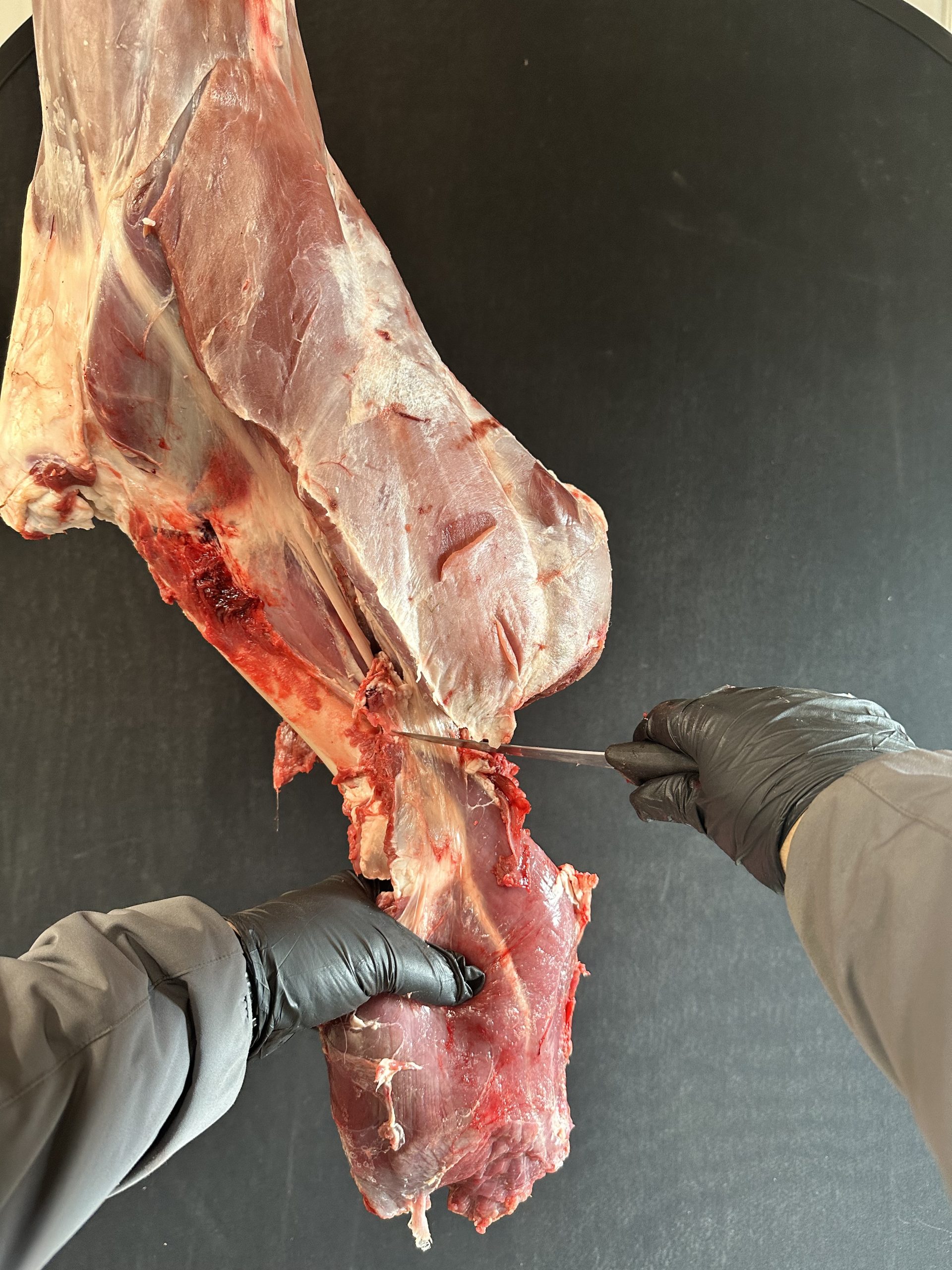 Cutting the top sirloin and freeing it from the bone