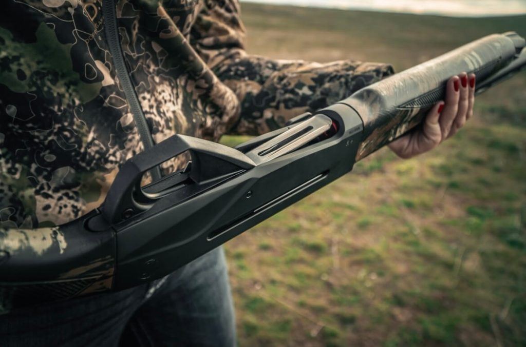 Hunter holding Weatherby's SORIX shotgun outside