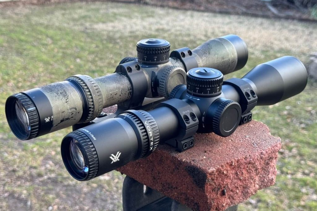 Strike Eagle 3-18 and Vortex Venom 3-15 scopes sitting on a brick