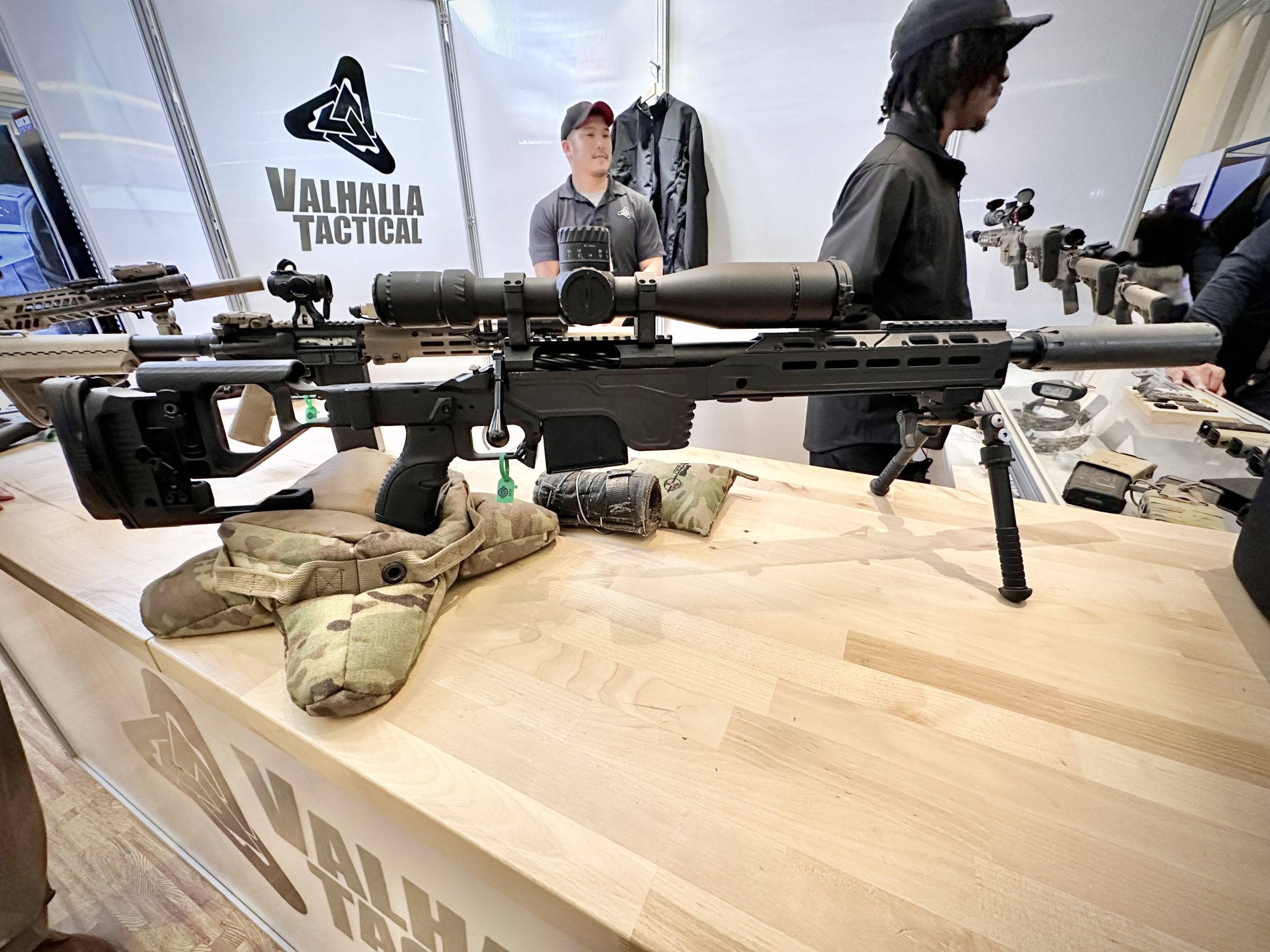 A rifle is displayed on a counter.