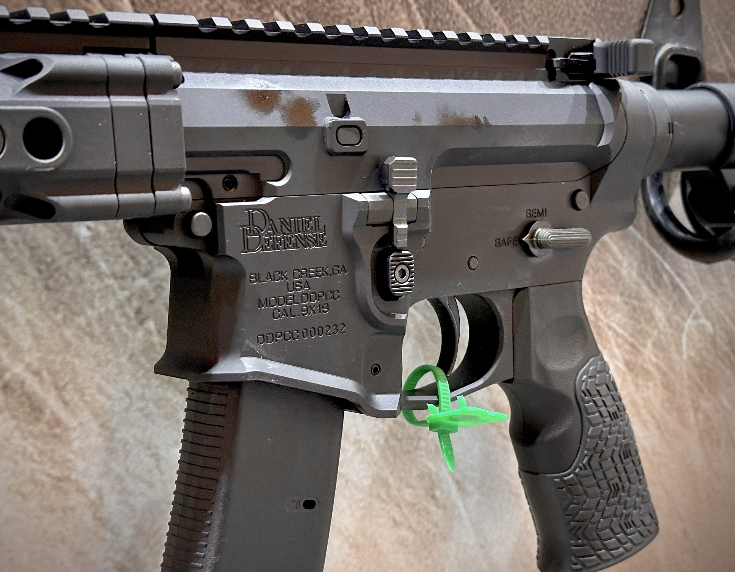 Closeup of a gun that resembles an AR15.