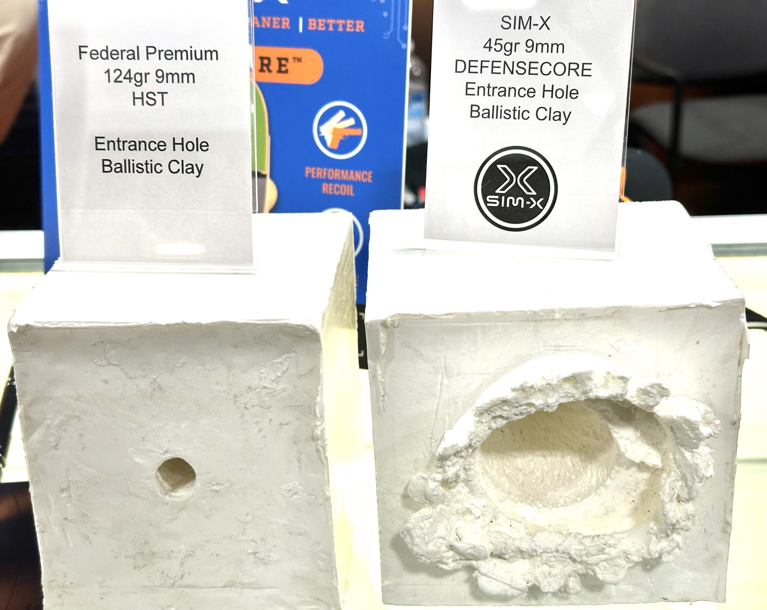 Two clay blocks show the differene in wound cavity between typical defensive 9mm ammunition and DefenseCore ammunition. The one on the left has a small 9mm hole in it while the one on the right has a fist-sized crater.