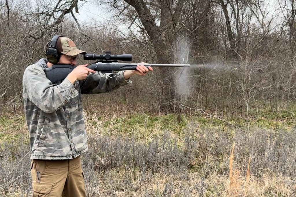 Man shooting rifle with the Vortex Venom 3-15 installed