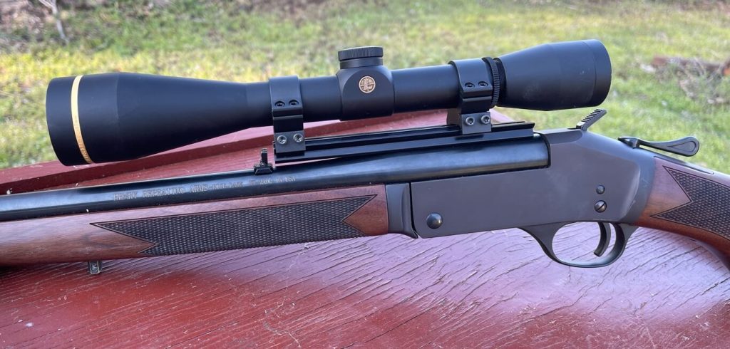 Henry Single Shot Rifle in .243 Winchester topped with a Leupold Scope.