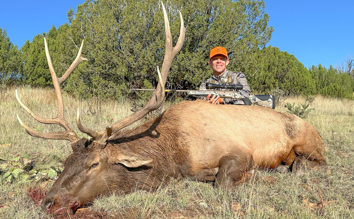 Hunter with large game and Browning X-Bolt 2 rifle