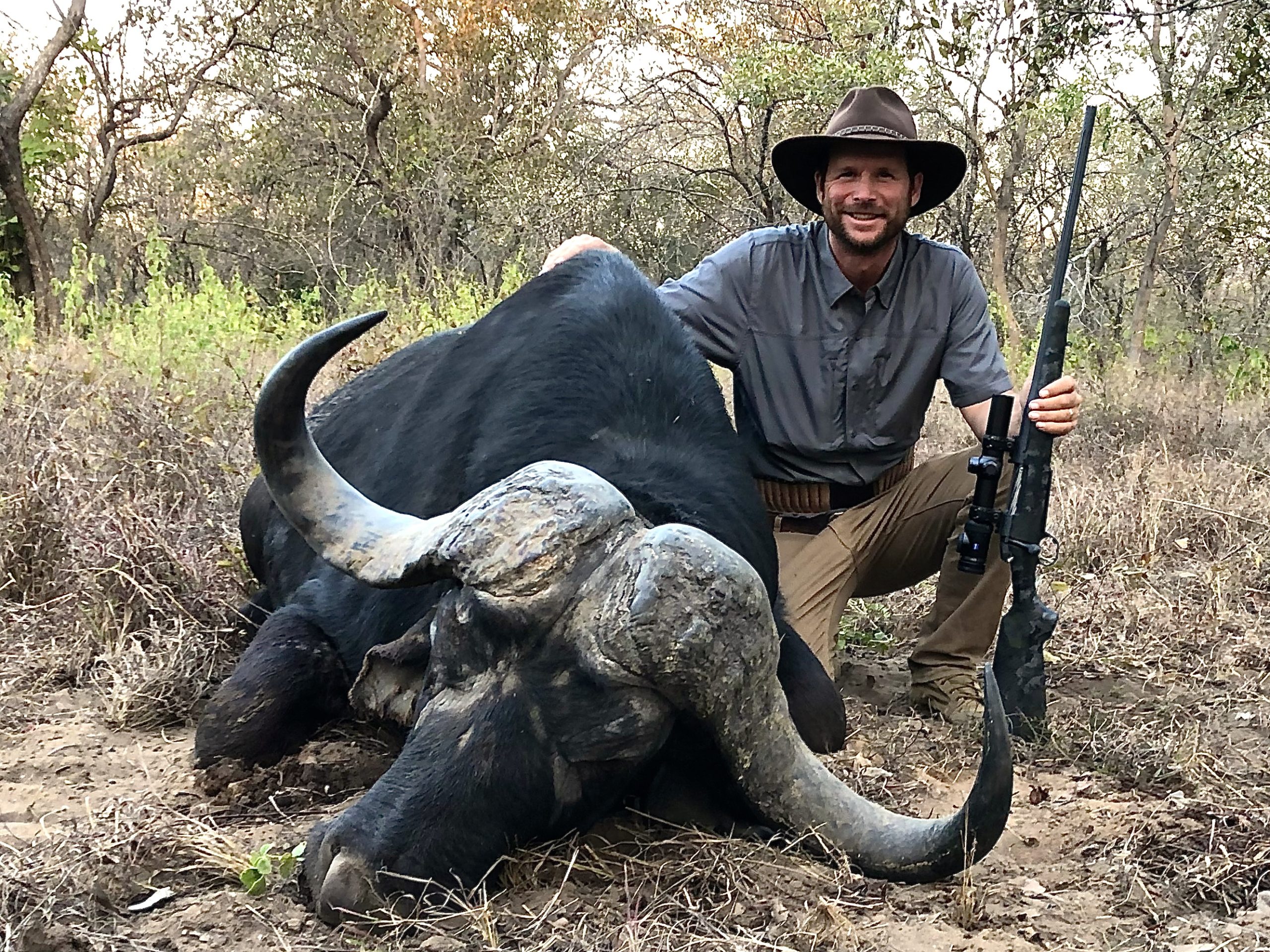 Hunter with his Bergara Canyon rifle and a massive buffalo