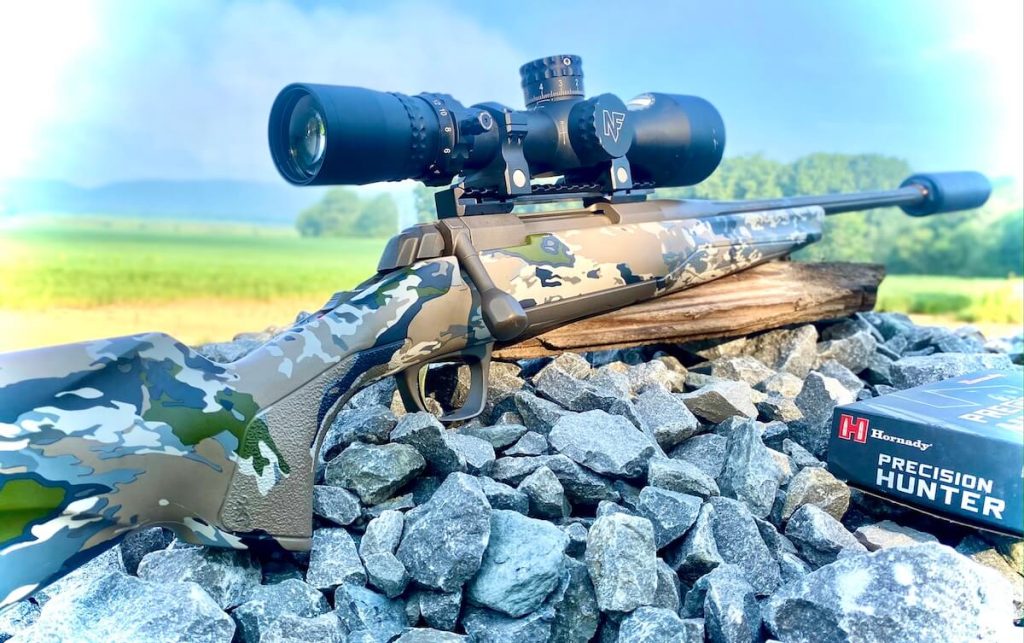 Browning X-Bolt Speed SR 7 PRC ready for the field, sitting on rustic rocks with Hornady ammo