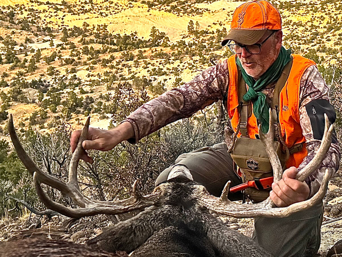 Jim admiring his monster mule deer