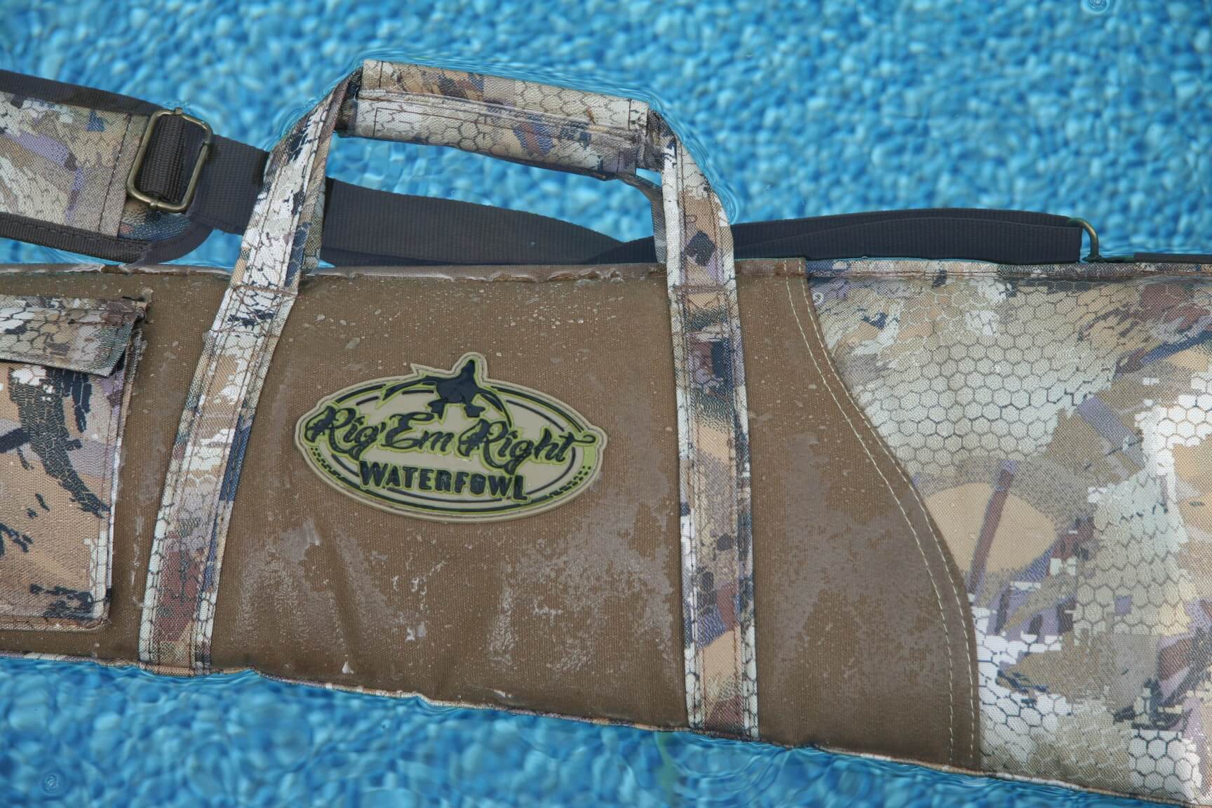 Rig 'Em Right gun case floating on crystal blue water