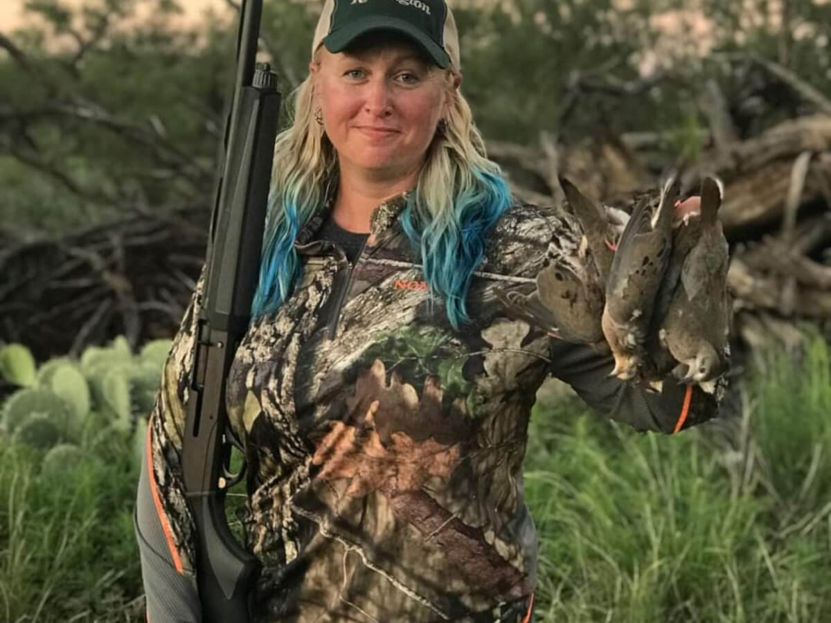 dove hunter with shotgun and doves