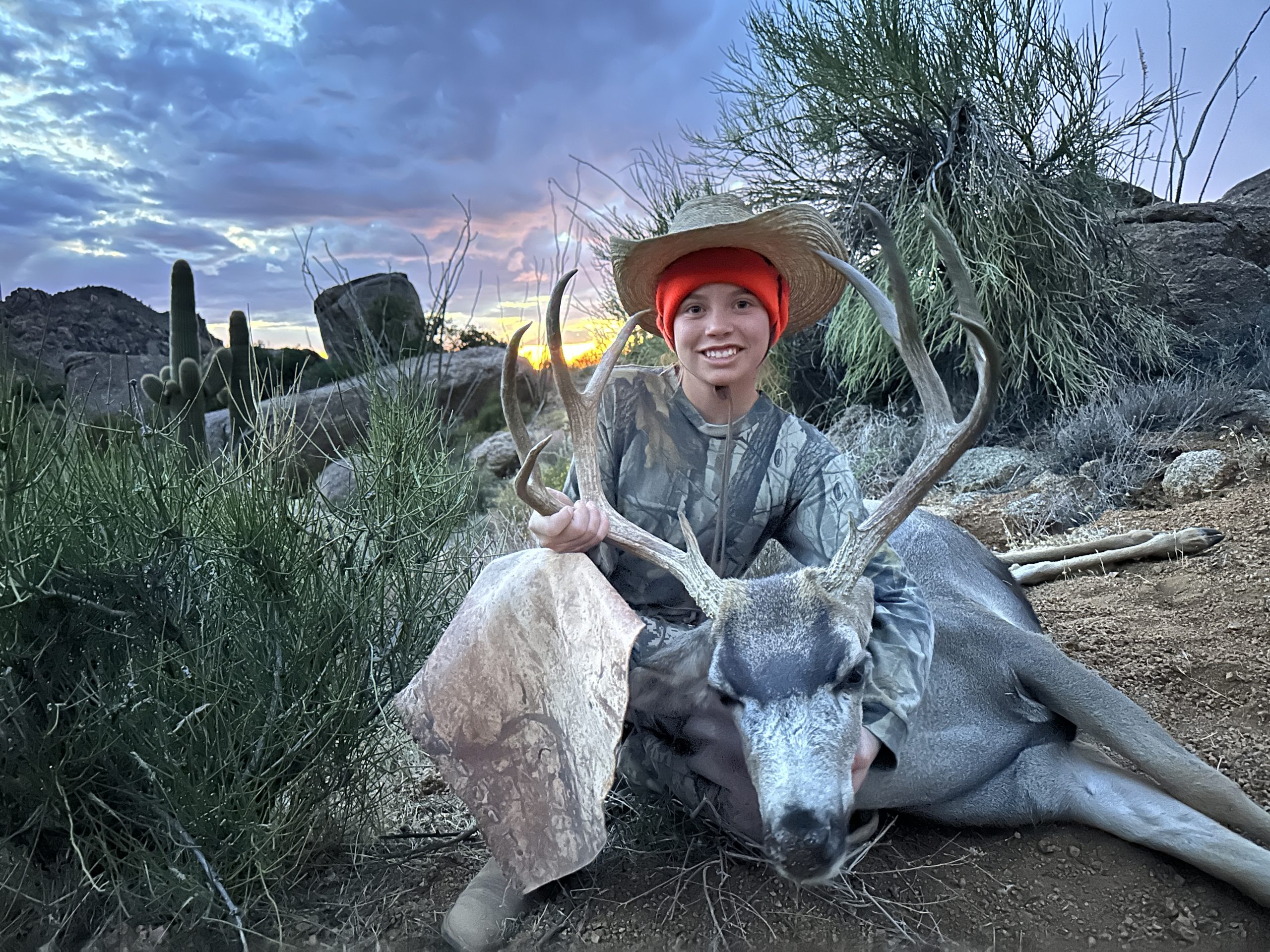 Elayna with her desert mule deer killed while hunting with horses.