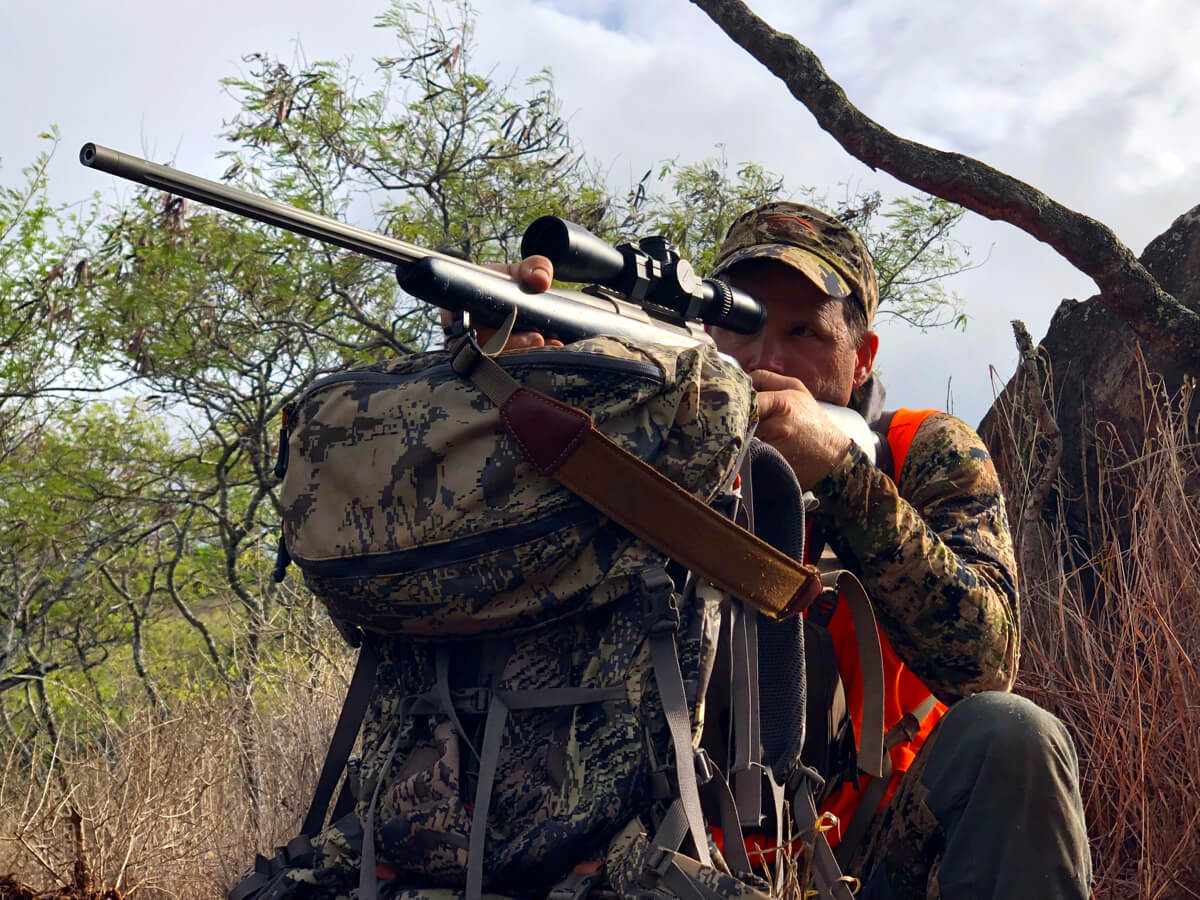 The author, utilizing his backpack as a field shooting rest.