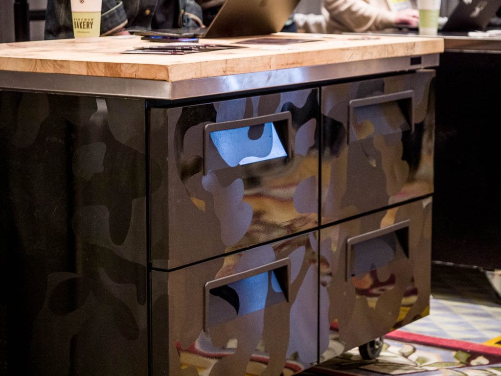 Freezer cabinet with drawers and a butcher-block top.